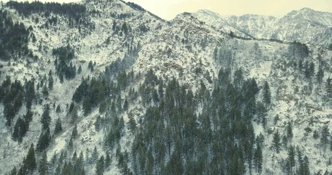 Flying DJI Mavic Pro through Ogden, Utah winter canyons along side traffic. Stock Footage 106510455