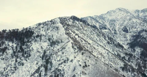 Flying DJI Mavic Pro through Ogden, Utah winter canyons along side traffic. Stock Footage 106510592