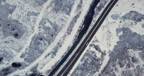 Flying DJI Mavic Pro through Ogden, Utah winter canyons along side traffic. Stock Footage 106542484