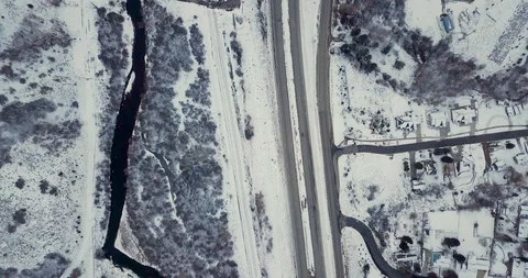 Flying DJI Mavic Pro through Ogden, Utah winter canyons along side traffic. Stock Footage 106542647