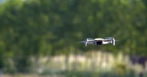 Flying DJI mini 2 drone Stock Footage 196911297