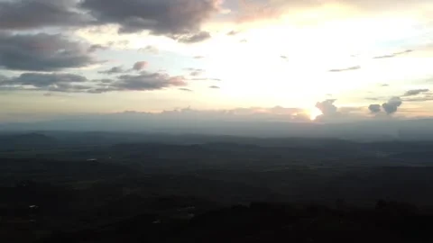 Flying with a dji mini 2 drone through a sports field until arriving at a town Stock Footage 235946495