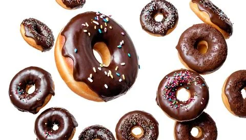 Flying Donuts On White Background Stock Photos