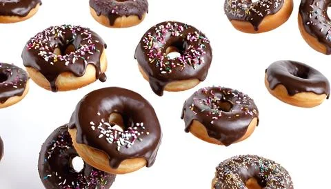 Flying Donuts On White Background Stock Photos