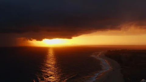 Flying down along sunset with waves and shoreline, aerial above Kauai, Hawaii Stock Footage 108474888