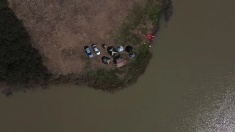 Flying down and rotate towards group of campers, Thailand Stockbeeldmateriaal 148847372