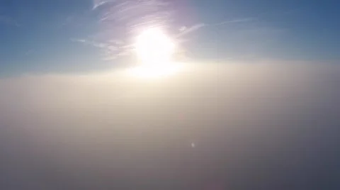 Flying down into the clouds at sunrise Stock Footage 43737451
