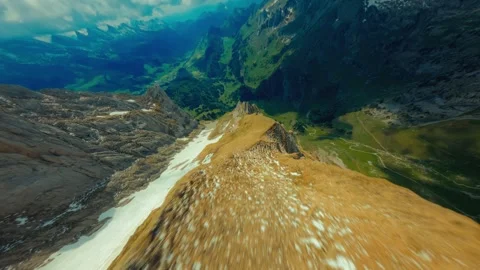 Flying down a mountain line in the Swiss Alps Stock Footage 311401606