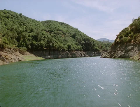 Flying down narrowing river 1989 Stock Footage 136072517