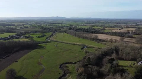 Flying down the River Adur where it joins the Cowfold Stream Stock Footage 184649368