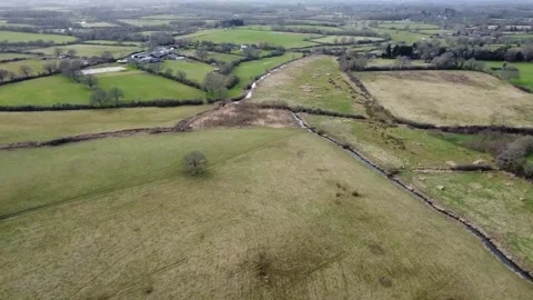 Flying down the River Adur from Wineham Stock Footage 184649355