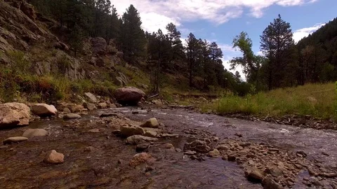 Flying Down Stream And Lift Up High Color Corrected Stock Footage 100209459