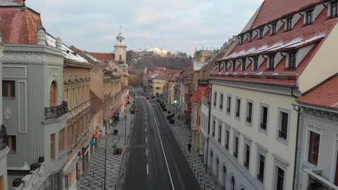 Flying down the street between buildings in Brasov, Romania. Stock Footage 108537918