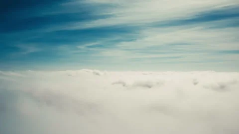 Flying down through moving clouds Stock Footage 274312396