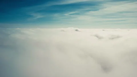 Flying down through moving clouds Stock Footage 274312492
