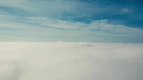 Flying down through moving clouds Stock Footage 274312679