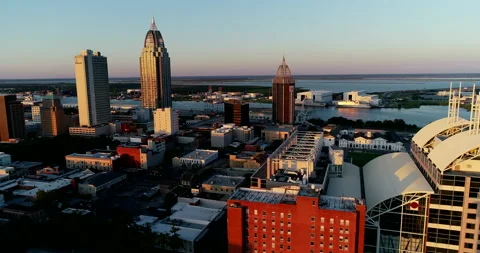 Flying into downtown Mobile at sunset Stock Footage 146631878