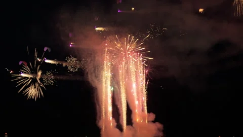 Flying Dragons Night Pass by Ground Fireworks with Airborne Pyrotechnics 動画素材 344794835