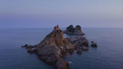 Flying drone 4K video around Sveta Nedjelja Island with magestic small church on Video stock 283940153