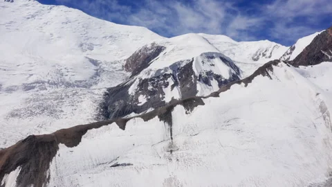 Flying Drone 4K Video of Glacier and Lenin Peak Wall Under Clear Sky With Mounta Видео 335949018