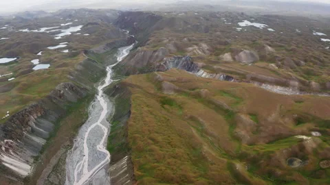 Flying drone 4K video over river canyon landscape during deep in Pamir mountains Video stock 331817129