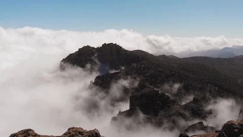 Flying drone above the clouds in the mountains, a beautiful panoramic view from Stock Footage 113229367