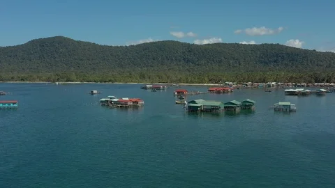 Flying by drone above Vietnamese floating fishing village in Phu Quoc island in Stock Footage 124415347