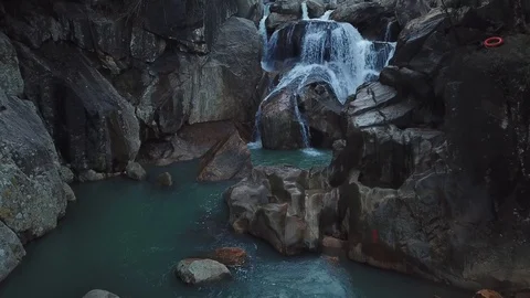 Flying on the drone above the wild waterfall in tropical palm forest. Beautiful 動画素材 112656116