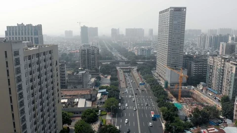 Flying a drone along a freeway in a large metropolis. Stock Footage 118143922