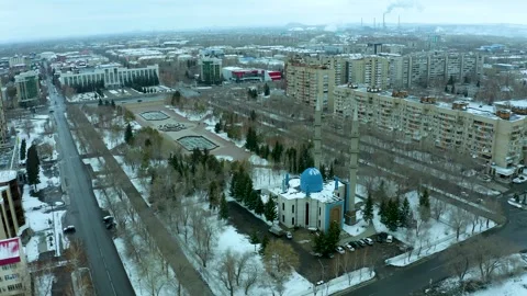 Flying on a drone around a mosque with a blue dome on the central square of city Stock Footage 240530436