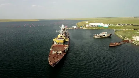 Flying a drone around an old, abandoned ship Stock Footage 160855243