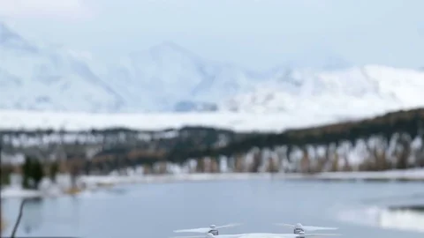 Flying drone on the background of a snow covered forest. Stock Footage 81443785