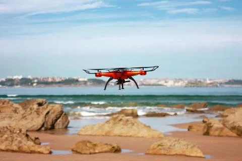 Flying drone on the beach Stock Photos