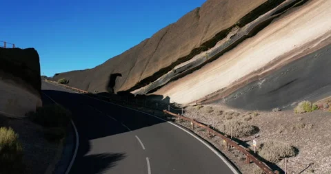 Flying a drone in a bend over the road, an incredible, beautiful landscape Stock Footage 143433700