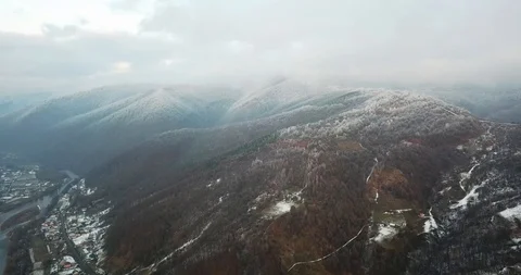 Flying drone between the mountains river winter snow 4k Stock Footage 123610392