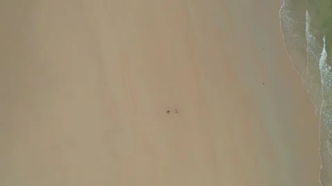 Flying drone captures stunning view of beach landscape at sunset in Donegal Stock Footage 310240285