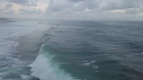 A flying drone captures the waves of the sea in Indonesia. Stock Footage 155972743