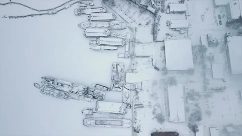 Flying on a drone directly above the shipyard and the stand where the ships are Stock Footage 219478514