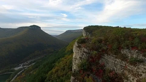 Flying with a drone at the edge of a cliff. Stock Footage 72535737
