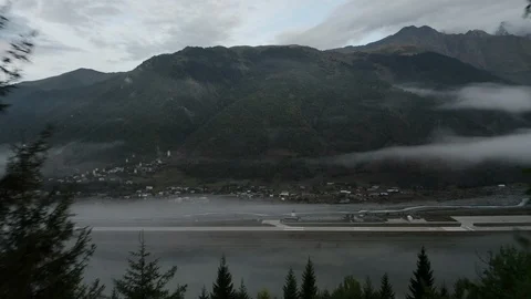 Flying drone in the fog through the trees Stock Footage 116665027