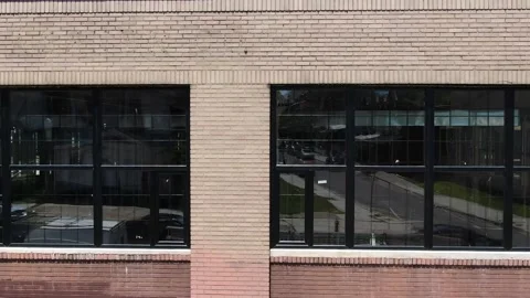 Flying a drone in front of a brick industrial building. Stock Footage 201476887