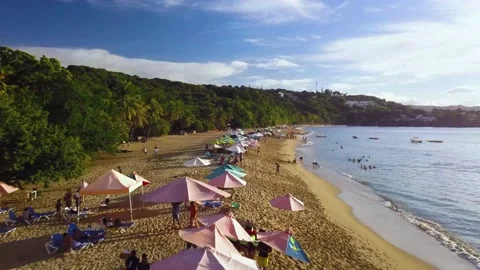 Flying drone low over Sosua Beach Dominican Republic Stock Footage 219830885