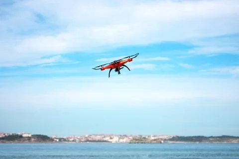 Flying drone with mounted camera on the beach Stock Photos