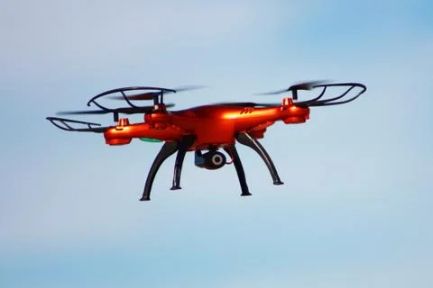 Flying drone with mounted camera Stock Photos