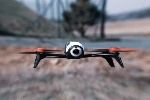 Flying drone with mounted camera takes a photos outdoor. Stock Photos