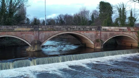 Flying Drone Near Bridge with Falling Water in Romiley, Stockport Stock Footage 104858145