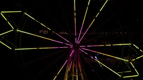 Flying Drone near Ferris Wheel. Amusement Park. Illuminations. Night Lights Neon Stock Footage 164635594