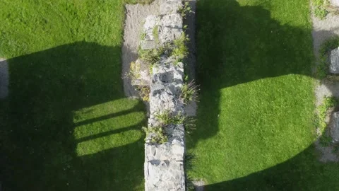 Flying drone over The Abbey Grounds ruins Wicklow, Ireland. Top down aerial shot Stock Footage 167654876