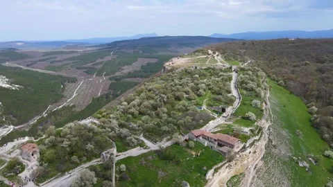 Flying a drone over an ancient cave city. Stock Footage 254167599