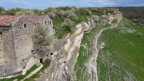 Flying a drone over an ancient cave city. Stock Footage 254167680